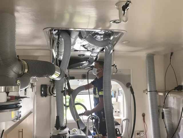 Bedford Air Duct Cleaning specialist performing precise mobile home duct cleaning in Bedford